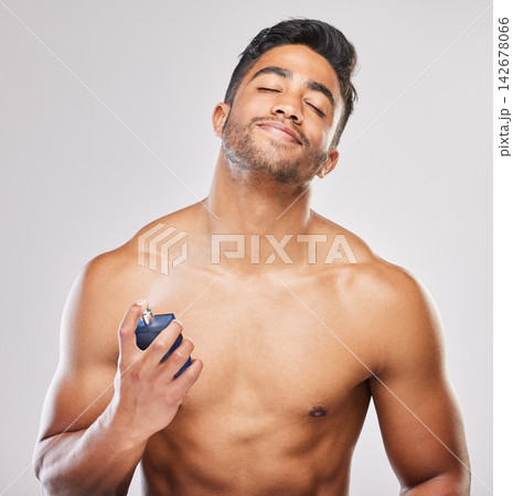 Happy, man and skincare with hands for deodorant spray for fresh scent, hygiene and grooming routine isolated in studio. Male person, shirtless and cologne or perfume for wellness on white background Happy, man and skincare with hands for deodorant spray for fresh scent, hygiene and grooming routine isolated in studio. Male person, shirtless and cologne or perfume for wellness on white background 142678066