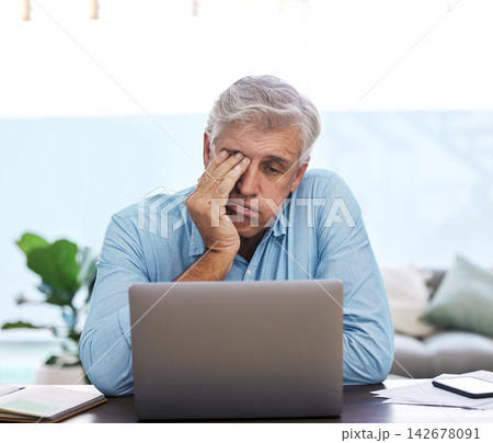Mature, businessman and burnout with laptop in home office for stress, overworked and tired in workplace. Male freelancer, technology and unhappy for job, mental health and project deadline at desk 142678091
