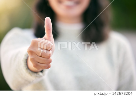 Hand, thumbs up and closeup for success outdoor, support or motivation for winning achievement goal in summer. Like, yes gesture and person with emoji for feedback, vote and thank you sign for review Hand, thumbs up and closeup for success outdoor, support or motivation for winning achievement goal in summer. Like, yes gesture and person with emoji for feedback, vote and thank you sign for review 142678204