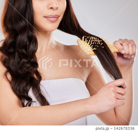 Haircare, shine and brush in studio, person and smile with treatment from salon, happy and texture. White background, growth and glow of hair, hairstyle and hairdresser for healthy, scalp and hand Haircare, shine and brush in studio, person and smile with treatment from salon, happy and texture. White background, growth and glow of hair, hairstyle and hairdresser for healthy, scalp and hand 142678336