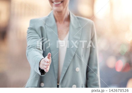 City, meeting or business woman offer handshake for collaboration, teamwork or partnership opportunity. Welcome, thank you or entrepreneur pov with shaking hands deal for b2b, hiring or job interview 142678526