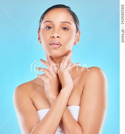 Woman, portrait and confident for skincare in studio on blue background on routine and satisfied with results. Natural, beauty and glow with facial for transformation, process and skin treatment Woman, portrait and confident for skincare in studio on blue background on routine and satisfied with results. Natural, beauty and glow with facial for transformation, process and skin treatment 142680568