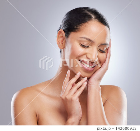 Cosmetics, happy and woman with skincare in studio for natural beauty, self care and shine. Female person, eyes closed and smile with pride for dermatology, spa treatment and glow on gray background 142680915