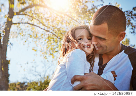 Happy, girl and hug from dad in garden, park or relax on adventure in summer, vacation or holiday. Father, love and care for child and bonding on travel in countryside or environment with family 142680987