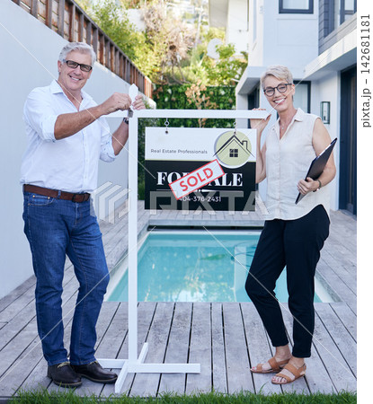 Mature couple, portrait and house sold with smile outdoor for property sale, mortgage and buying home. Happy, people or realtors on real estate for deal, move and relocation or investment Mature couple, portrait and house sold with smile outdoor for property sale, mortgage and buying home. Happy, people or realtors on real estate for deal, move and relocation or investment 142681181