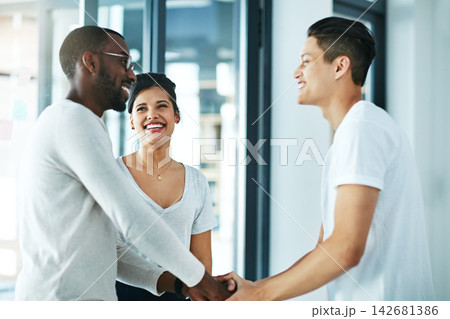 Creative people, handshake and meeting with team for agreement, deal or startup together at office. Businessman shaking hands with employee or colleague for partnership or collaboration at workplace Creative people, handshake and meeting with team for agreement, deal or startup together at office. Businessman shaking hands with employee or colleague for partnership or collaboration at workplace 142681386