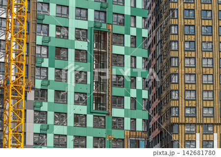 Building progress showcases vibrant architecture under construction in an urban landscape 142681780