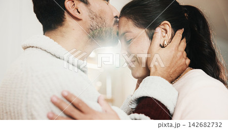 Forehead, kiss and happy couple in home, love and bonding with partner on break or marriage loyalty. House, flare and connection with spouse, relationship commitment and people with smile on weekend 142682732