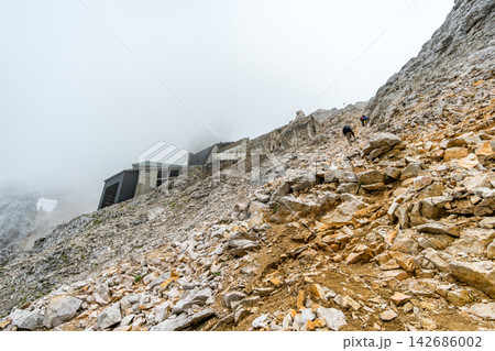 Rocky Mountain Hiking Trail with Foggy Alpine Landscape Rocky Mountain Hiking Trail with Foggy Alpine Landscape 142686002