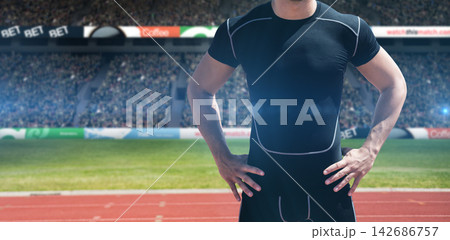 Athlete in Compression Shirt at Stadium Track Athlete in Compression Shirt at Stadium Track 142686757