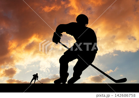 Ice Hockey Player Silhouette at Sunset Sky Ice Hockey Player Silhouette at Sunset Sky 142686758