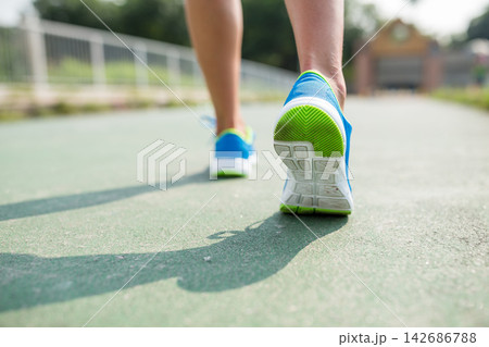 Running Shoes Close-Up on Outdoor Track in Active Fitness Style Running Shoes Close-Up on Outdoor Track in Active Fitness Style 142686788
