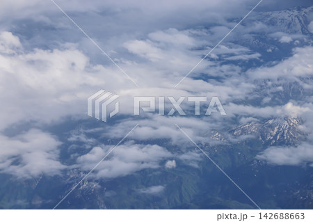 Aerial cloudscape over mountain range landscape 142688663