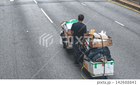 Aug 22 2026 Hong Kong Worker Pushing Loaded Cardboard Trolley Aug 22 2026 Hong Kong Worker Pushing Loaded Cardboard Trolley 142688841