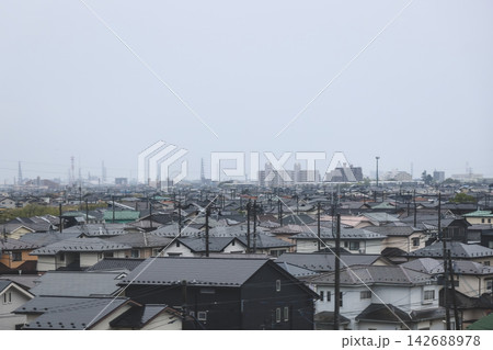 April 27 2026 Morioka urban residential rooftops with powerlines and distant skyline 142688978