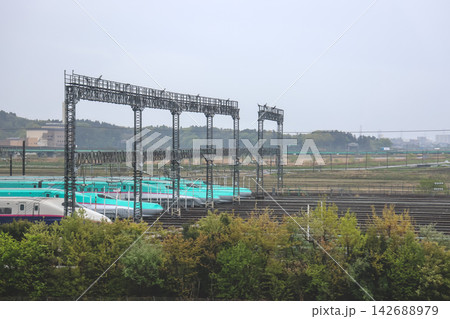 April 27 2026 Sendai Shinkansen depot with multiple trains and surrounding greenery 142688979