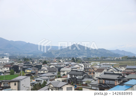 April 27 2026 Morioka rural village with houses farmland and distant mountain range April 27 2026 Morioka rural village with houses farmland and distant mountain range 142688995