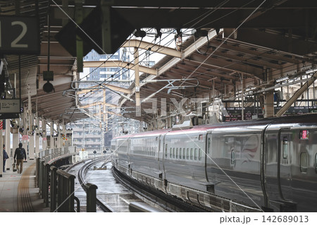 April 27 2026 Sendai Station platform with green Shinkansen and passengers waiting April 27 2026 Sendai Station platform with green Shinkansen and passengers waiting 142689013
