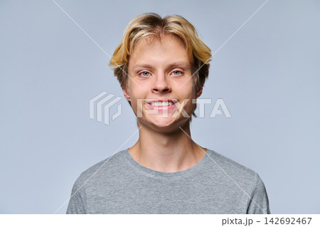 Close up portrait of smiling teenage boy looking at camera Close up portrait of smiling teenage boy looking at camera 142692467