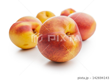 Fresh Ripe nestarines On White Background, Close-Up Summer Fruit Still Life For Healthy Eating Fresh Ripe nestarines On White Background, Close-Up Summer Fruit Still Life For Healthy Eating 142694143