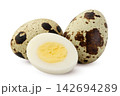 Boiled quail eggs and a peeled half close-up on a white background. Isolated 142694289