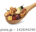 A mix of dried fruits and nuts in a wooden spoon on a white background. Isolated. 142694290