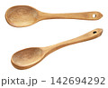 Set of wooden spoons close-up on a white background. Isolated 142694292