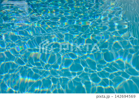 blue blurred textured swimming pool water surface waving motion by wind blow at noon sunshine blue blurred textured swimming pool water surface waving motion by wind blow at noon sunshine 142694569