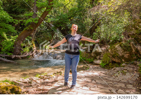 Travel Woman happy in a park spring near water 142699170