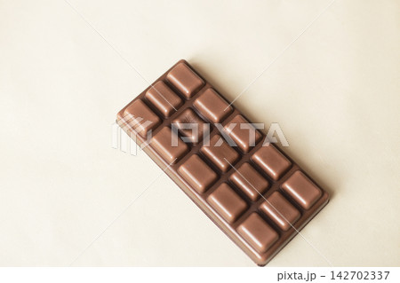 Milk chocolate candy bar with missing segment Milk chocolate candy bar with missing segment 142702337
