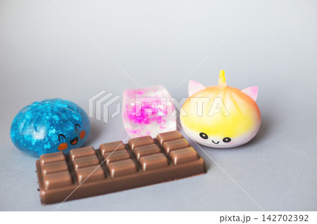 Colorful collection of stress relief squishy toys and chocolate Colorful collection of stress relief squishy toys and chocolate 142702392