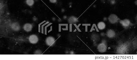 Black Background with Soft White Bokeh Lights and Abstract Glowing Effects 142702451