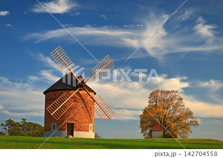 Beautiful old windmill and landscape with the sun. Chvalkovice - Czech Republic. Europe. 142704558