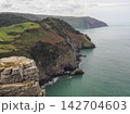 Coastal cliffs and sea view from Castle Rock, Valley of Rocks, Exmoor, Devon 142704603