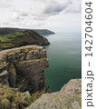 Sheer cliffs and coastal vista from Castle Rock, Valley of Rocks, Exmoor, Devon 142704604