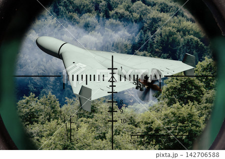 Military drone targeted through rifle scope over forest background view Military drone targeted through rifle scope over forest background view 142706588