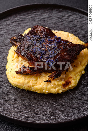 Duck leg confit roasted with salt and allspice. Duck leg confit 142706909