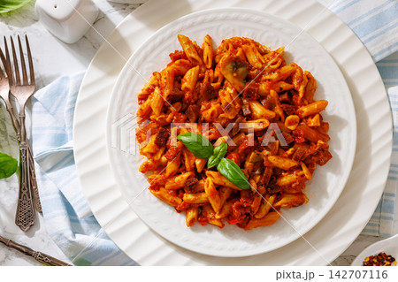 Italian penne dish with diced sausage, mushrooms Italian penne dish with diced sausage, mushrooms 142707116