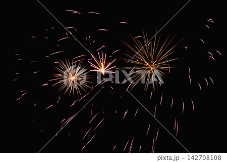 Fireworks lighting up the night sky. Pyrotechnics, abstract Fireworks lighting up the night sky. Pyrotechnics, abstract 142708108