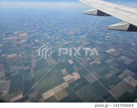 Airplane Wing Above Patchwork Farmland on Flight from Buenos Aires to Cordoba 142708884