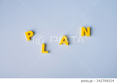 Planning process, business strategy and organizing ideas with scattered PLAN letters 142709324