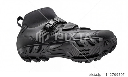 Black cycling shoe for mountain biking with textured tread and adjustable strap footwear mountain athletic traction fastener equipment professional performance technical lifestyle textured Black cycling shoe for mountain biking with textured tread and adjustable strap footwear mountain athletic traction fastener equipment professional performance technical lifestyle textured 142709595