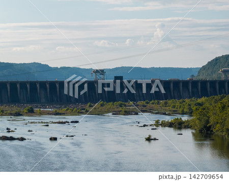 Aerial drone view of a massive hydroelectric dam on a wide river Aerial drone view of a massive hydroelectric dam on a wide river 142709654