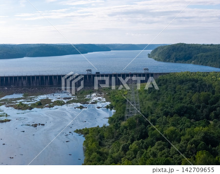 Drone view of a large hydroelectric power plant dam on a scenic river Drone view of a large hydroelectric power plant dam on a scenic river 142709655