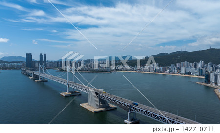 Aerial View of Gwangan Bridge, Marine City Skyline, and Dongbaekseom Island in Busan, South Korea Aerial View of Gwangan Bridge, Marine City Skyline, and Dongbaekseom Island in Busan, South Korea 142710711