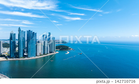 Aerial View of Gwangan Bridge, Marine City Skyline, and Dongbaekseom Island in Busan, South Korea 142710716