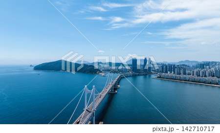 Aerial View of Gwangan Bridge, Marine City Skyline, and Dongbaekseom Island in Busan, South Korea Aerial View of Gwangan Bridge, Marine City Skyline, and Dongbaekseom Island in Busan, South Korea 142710717