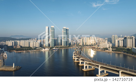 Aerial View of Gwangan Bridge, Marine City Skyline, and Dongbaekseom Island in Busan, South Korea 142710719