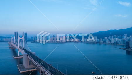 Aerial View of Gwangan Bridge, Marine City Skyline, and Dongbaekseom Island in Busan, South Korea 142710738
