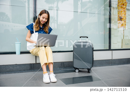 An independent businesswoman types away on her laptop An independent businesswoman types away on her laptop 142711510